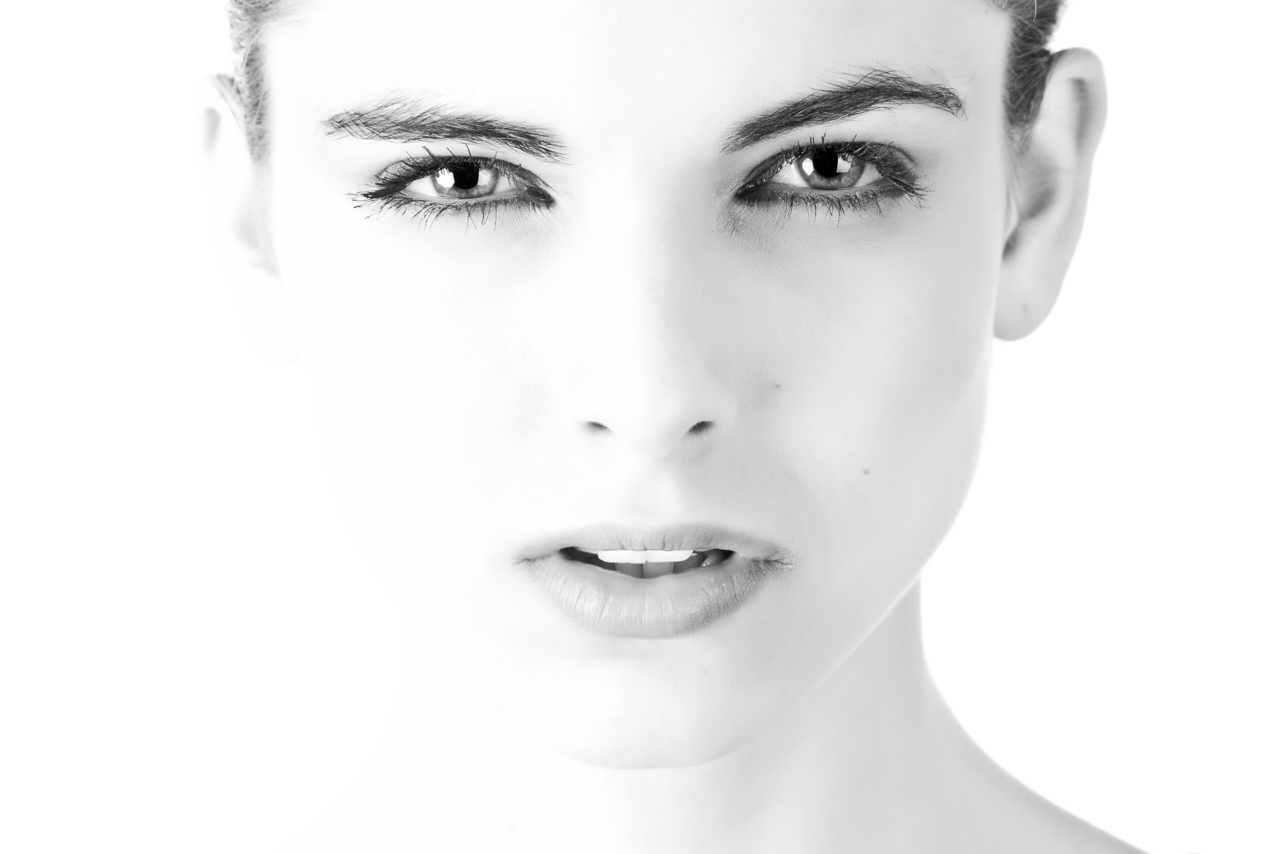 Woman with beautiful skin at the camera representing the best food for your skin